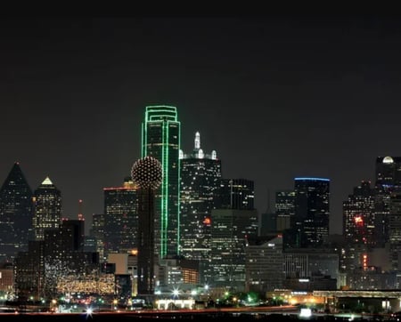 Night view of the Dallas skyline with illuminated skyscrapers, representing fractional CFO services across Fort Worth and the DFW Metroplex.